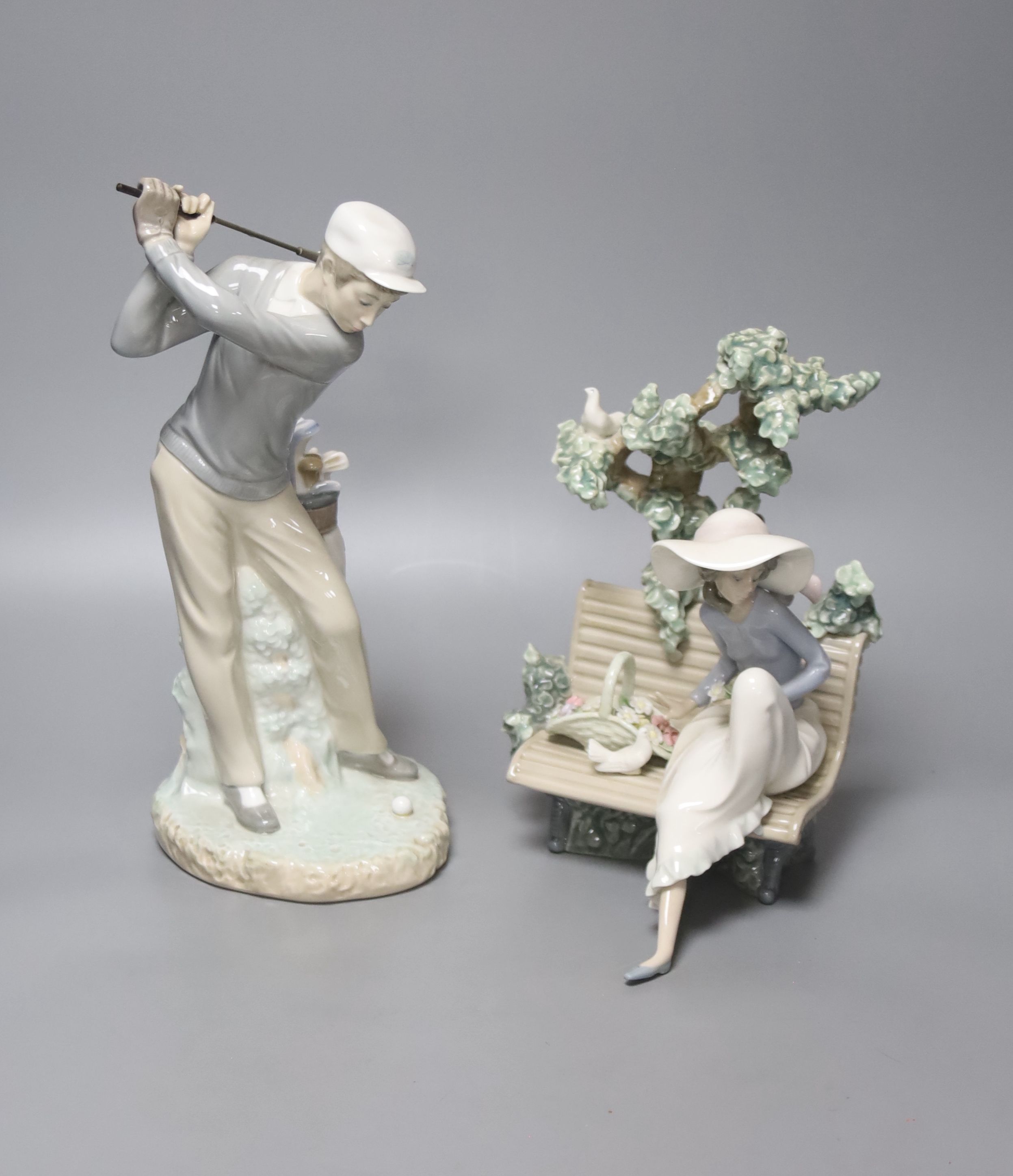 A Lladro figure, 'Sunday in the Park', no. 5365 and another 'Golfer', no. 4284 (2)